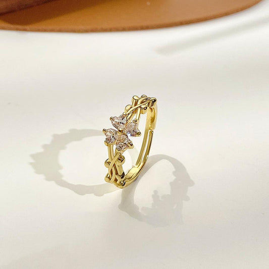 Retro micro-inlaid zircon four-leaf clover ring female fashion personality vine winding adjustable flower index finger ring