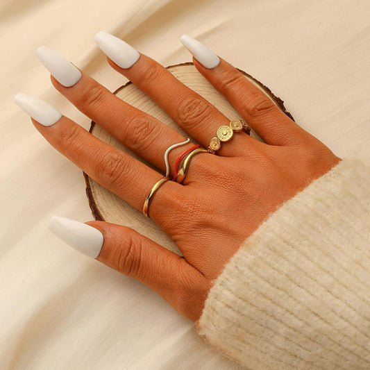 Sweet and fresh niche high-end fashion design ladies stainless steel gold coin water wave drop oil ring set