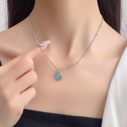 Simple niche light luxury oval titanium steel necklace blue cat's eye pendant clavicle chain temperament design high-end jewelry