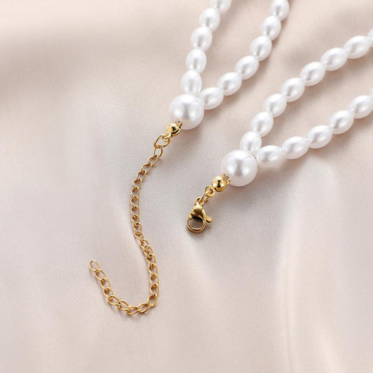 Fashion personality stainless steel angel wings titanium steel pendant simple temperament elegant double pearl necklace female