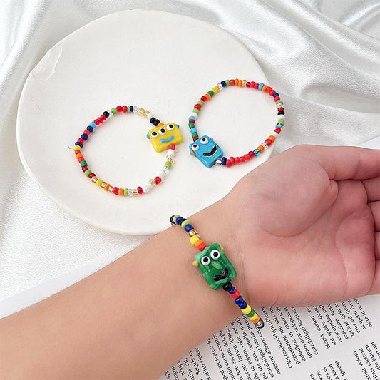 Cartoon little monster color beaded ceramic bracelet female niche design net red bracelet ins tide does not fade jewelry
