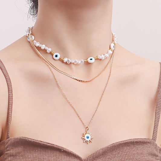 Jewelry ins multi-layer devil's eye beaded necklace female niche design imitation pearl clavicle chain