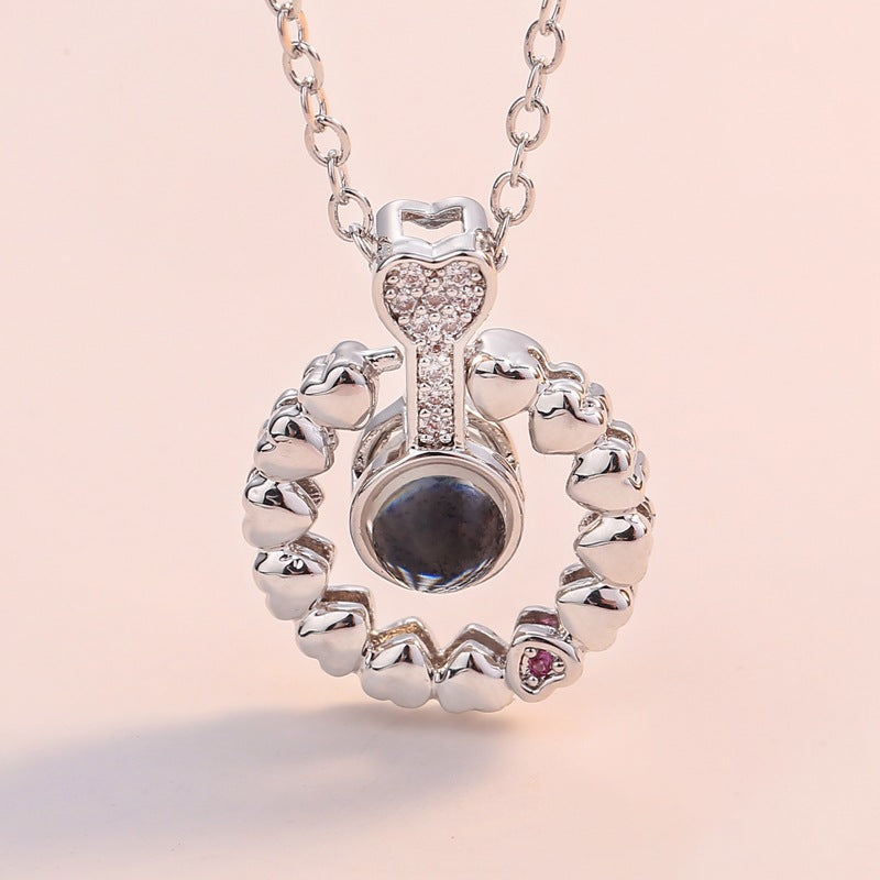 The same round micro-inlaid zircon small love pendant in one hundred languages I love you necklace