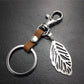 Hollow out leaves titanium steel jewelry accessories cowhide key chain 316 stainless steel men's waist hanging women's bag pendant