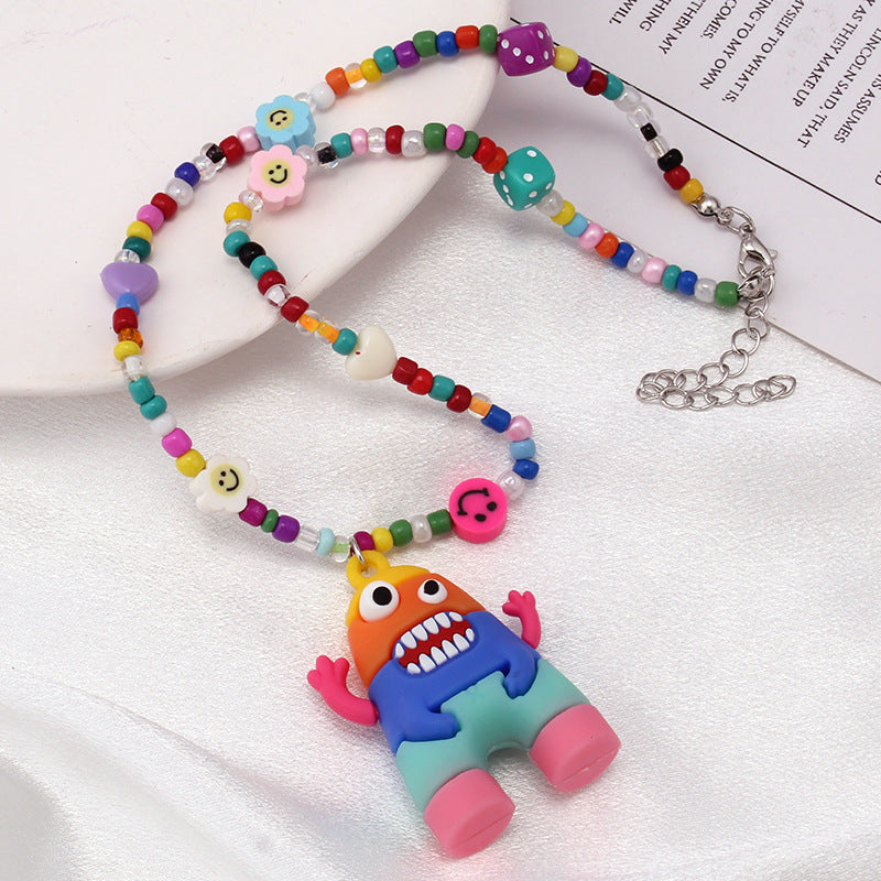 Ins niche design cartoon rainbow monster pendant rice bead necklace hip-hop all-match sweater chain trend style