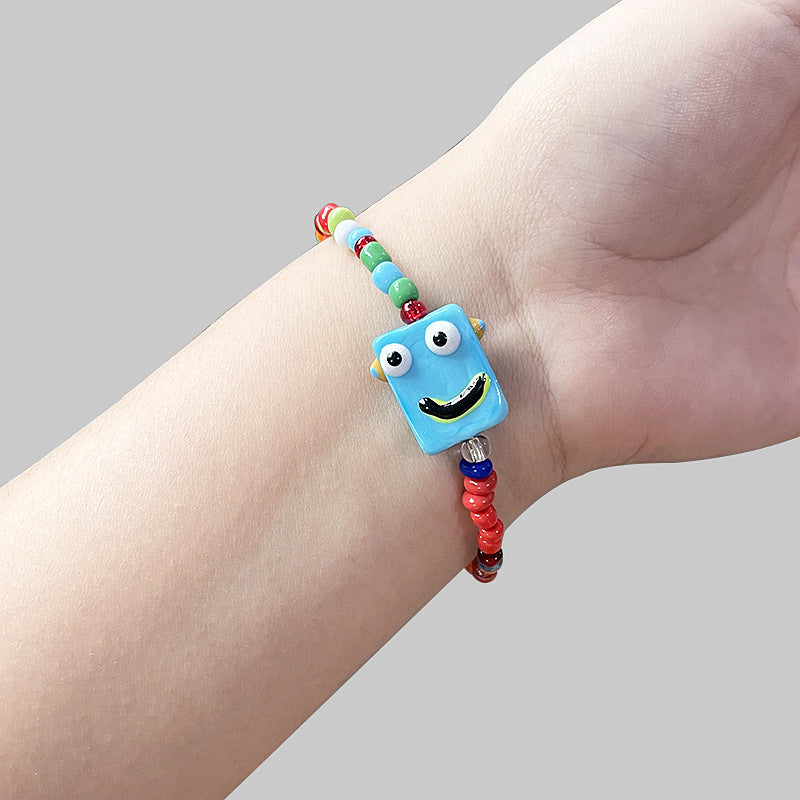 Cartoon little monster color beaded ceramic bracelet female niche design net red bracelet ins tide does not fade jewelry