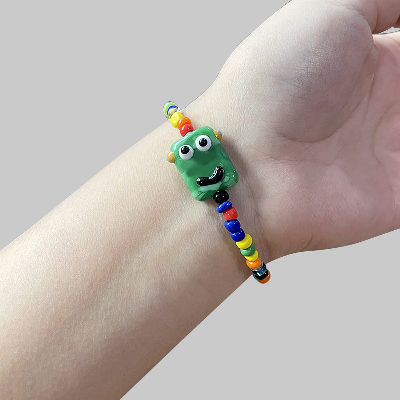 Cartoon little monster color beaded ceramic bracelet female niche design net red bracelet ins tide does not fade jewelry