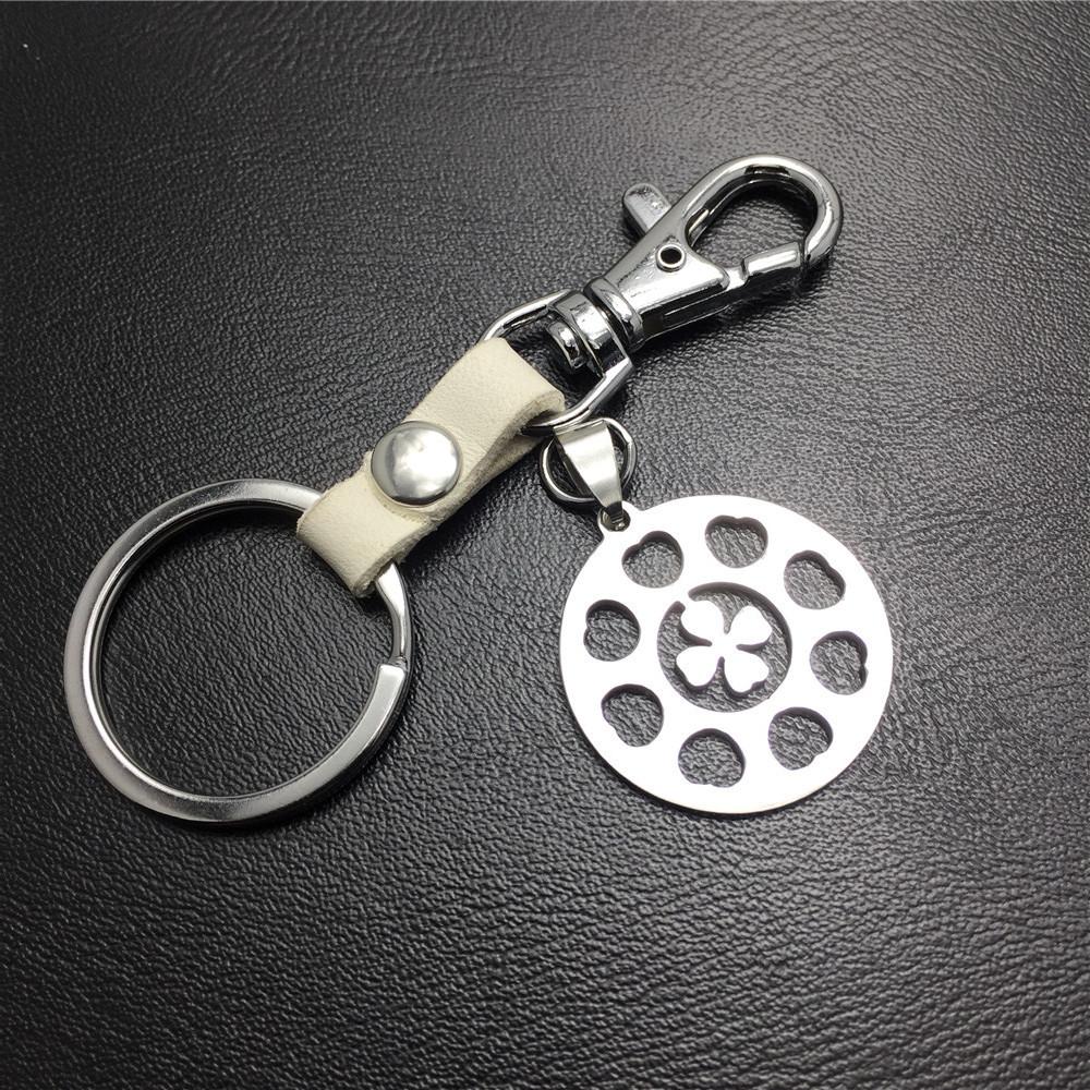 Four-leaf lucky flower titanium steel jewelry stainless steel luggage pendant leather key chain waist hanging couple gift bag listing
