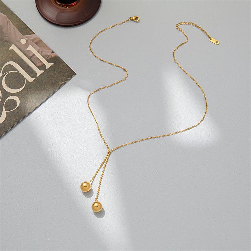 Autumn and winter tassel ball sweater chain retro titanium steel gold-plated ins long necklace jewelry high-end