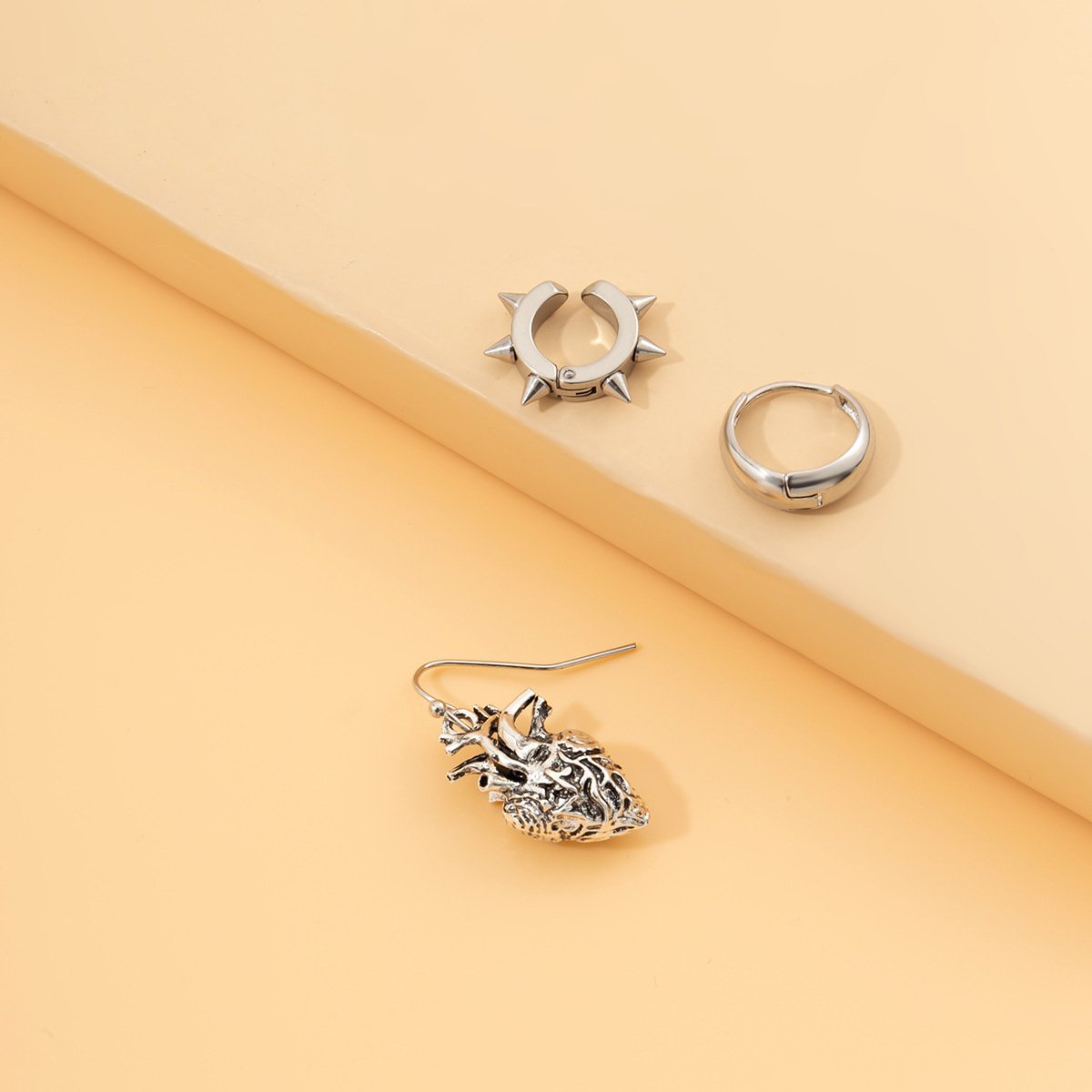 Jewelry personality heart three-dimensional asymmetric set earrings female punk dark rivet earrings