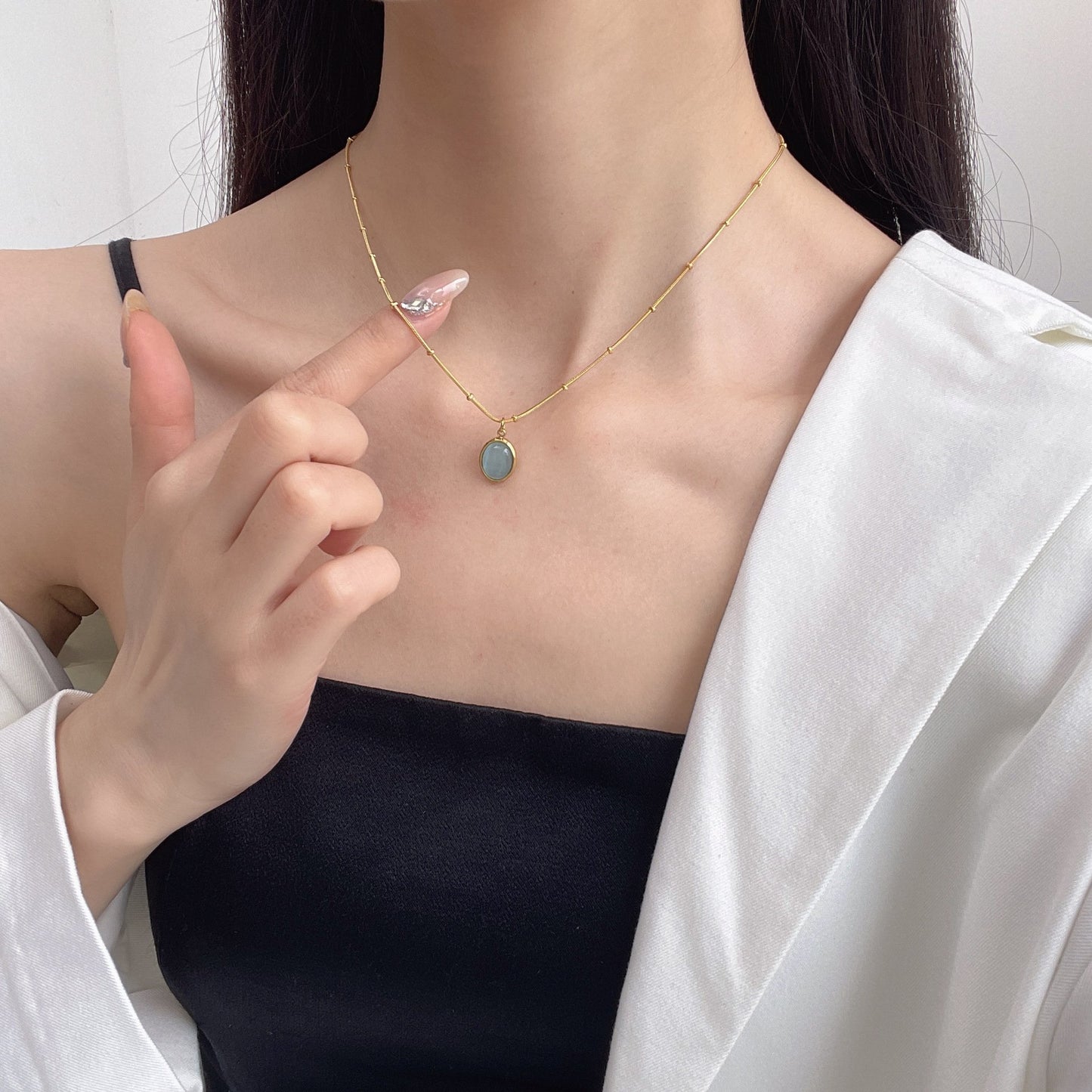 Simple niche light luxury oval titanium steel necklace blue cat's eye pendant clavicle chain temperament design high-end jewelry