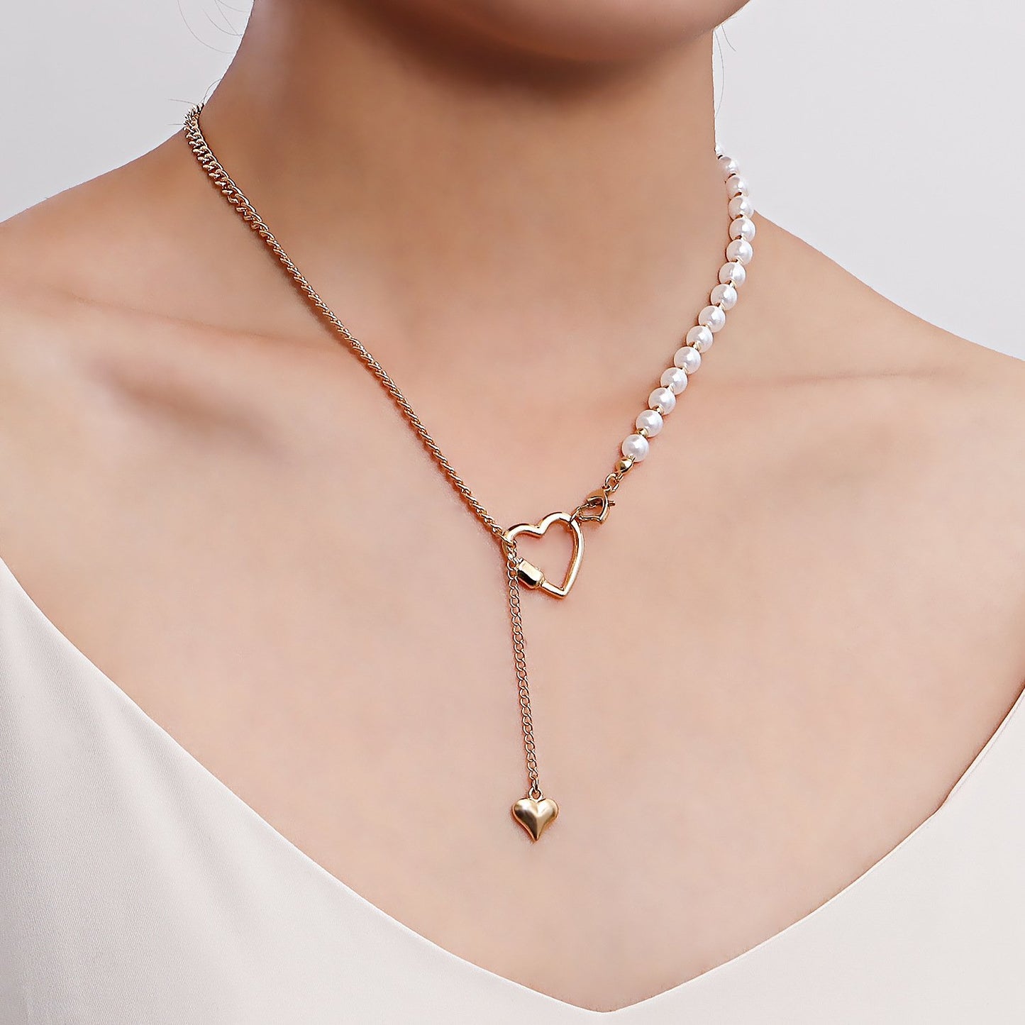 Retro imitation pearl stitching personality clavicle necklace simple geometric heart asymmetrical metal necklace ins