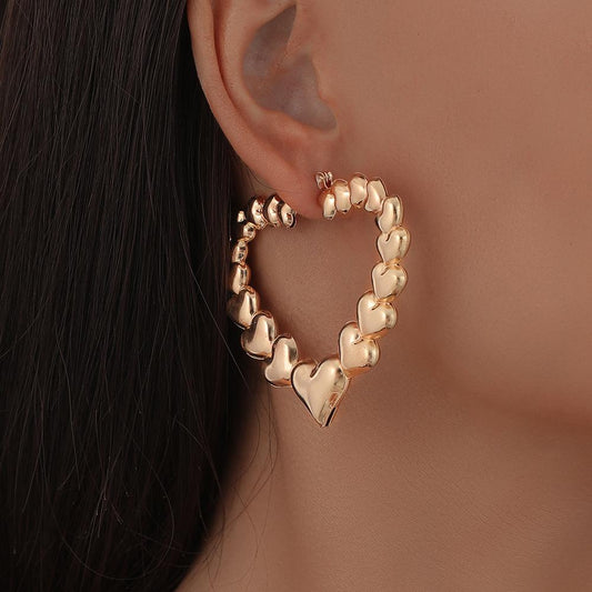 Simple trend personality metal hollow three-dimensional heart-shaped glossy earrings ins temperament retro earrings female