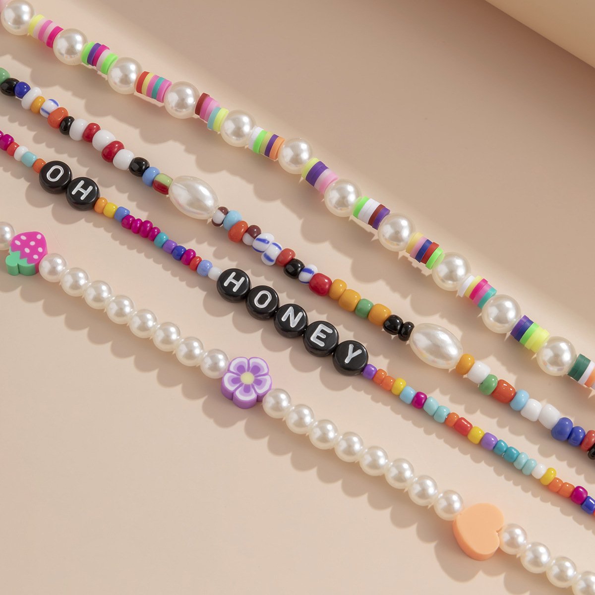 Jewelry personalized letters mix and match heart-shaped multi-layer necklace contrasting color rice beads soft pottery imitation pearl necklace