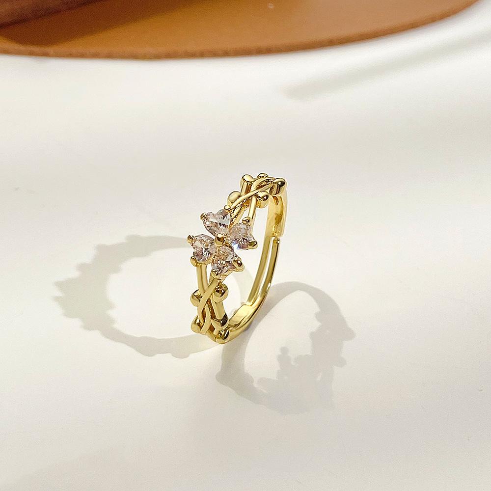 Retro micro-inlaid zircon four-leaf clover ring female fashion personality vine winding adjustable flower index finger ring