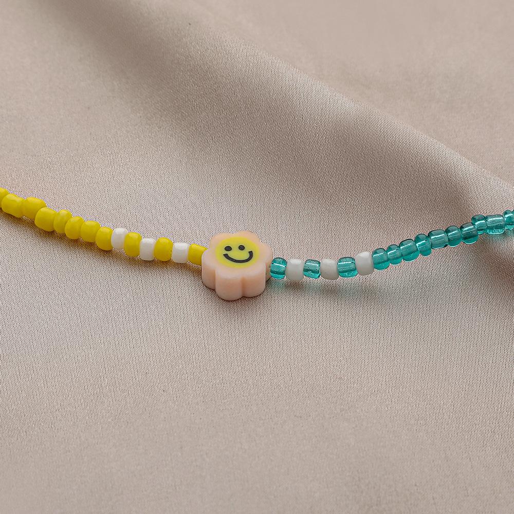 Trendy personality asymmetric rice beads soft pottery cartoon smiley face necklace fashion bohemian beautiful collarbone chain