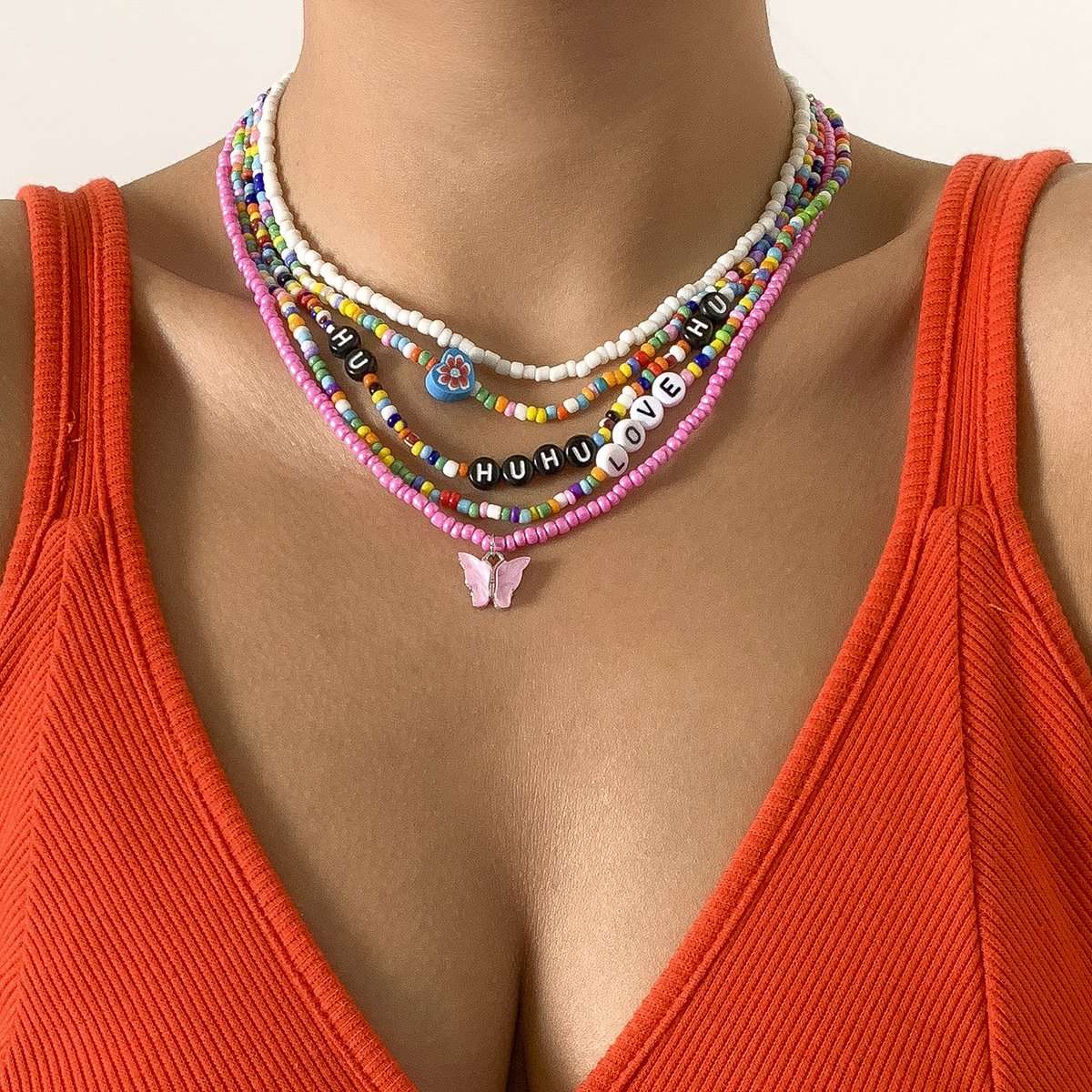 Jewelry mix-and-match butterfly multi-layer tassel rice bead necklace female contrast color pastoral letter flower necklace