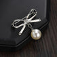 Temperament simple pearl bow brooch women's clothes fixed anti-light buckle pin corsage clothing accessories