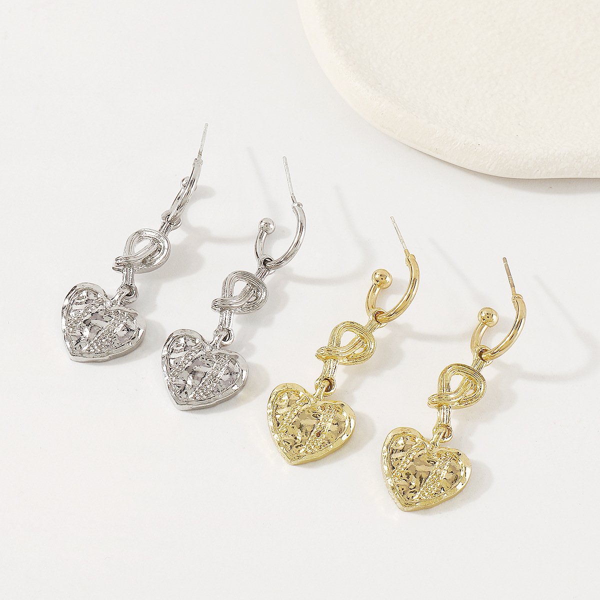 E146 French niche retro knotted love earrings metal irregular texture geometric simple earrings