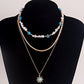 Jewelry ins multi-layer devil's eye beaded necklace female niche design imitation pearl clavicle chain
