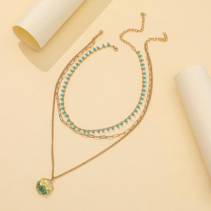 Fashion turquoise rice bead necklace personalized creative gravel pendant three-layer metal chain necklace tide