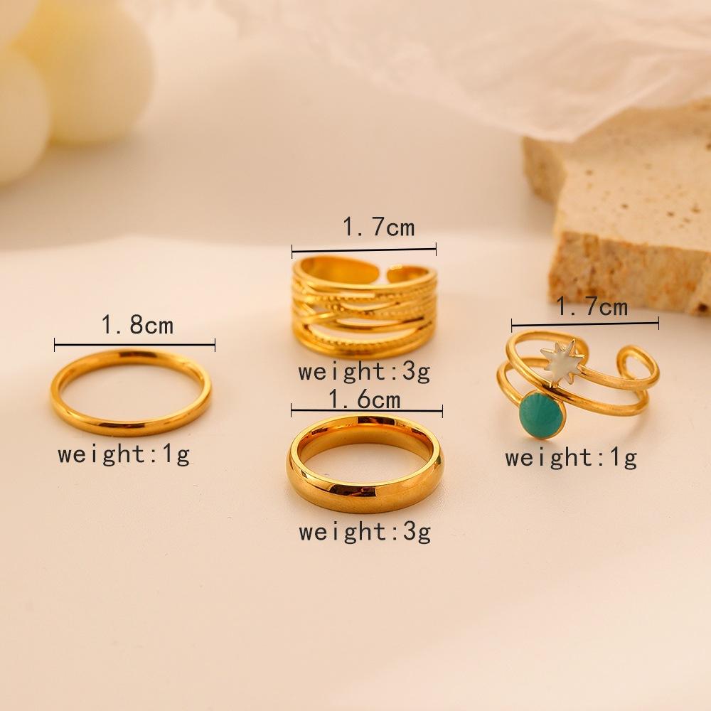 Light luxury niche trend fashion stainless steel opening star hollow four-piece suit ring female
