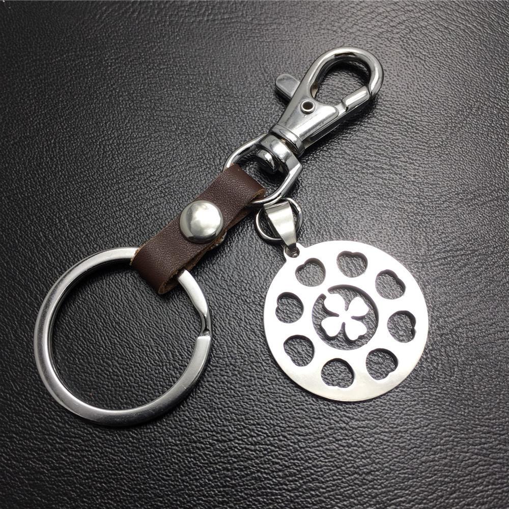 Four-leaf lucky flower titanium steel jewelry stainless steel luggage pendant leather key chain waist hanging couple gift bag listing
