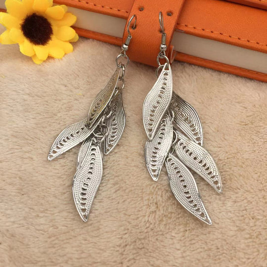 Three-dimensional curved surface hollow wicker tassel female earrings Yunnan minority fashion metal earrings