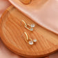 Ins copper inlaid zircon U-shaped geometric earrings French light luxury personality temperament hollow ball earrings earrings