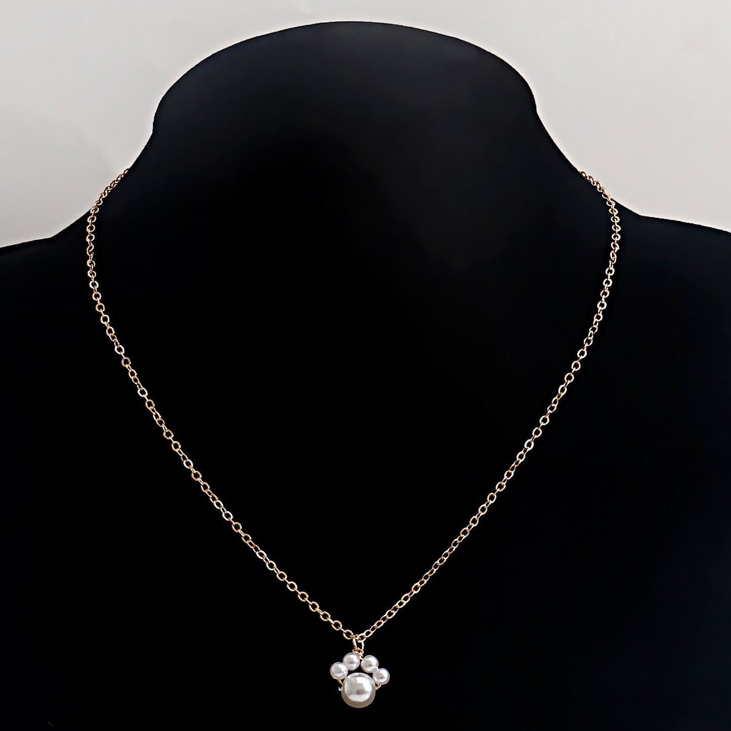 Jewelry ins simple creative dog footprints imitation pearl pendant necklace female minority design sense light luxury