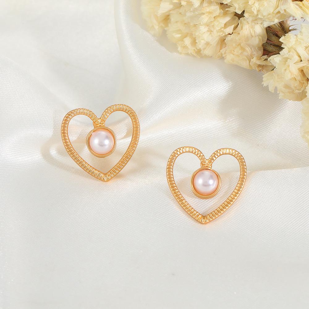 Ins inlaid pearl love earrings female fashion temperament niche design hollow love earrings simple earrings