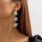 E118 Simple three-dimensional metal flower earrings cold design pearl long temperament earrings