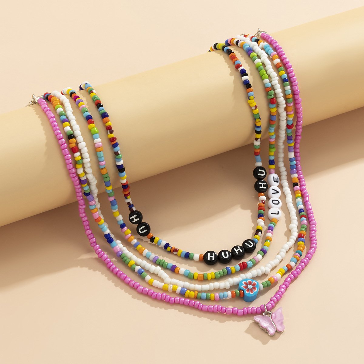 Jewelry mix-and-match butterfly multi-layer tassel rice bead necklace female contrast color pastoral letter flower necklace