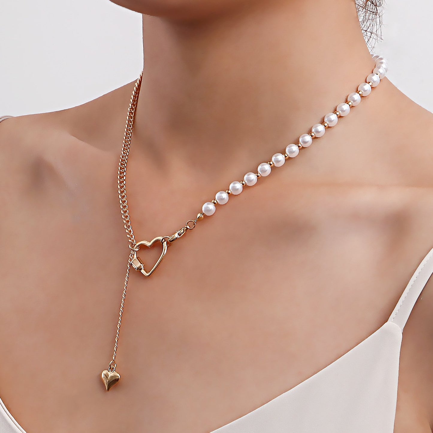 Retro imitation pearl stitching personality clavicle necklace simple geometric heart asymmetrical metal necklace ins