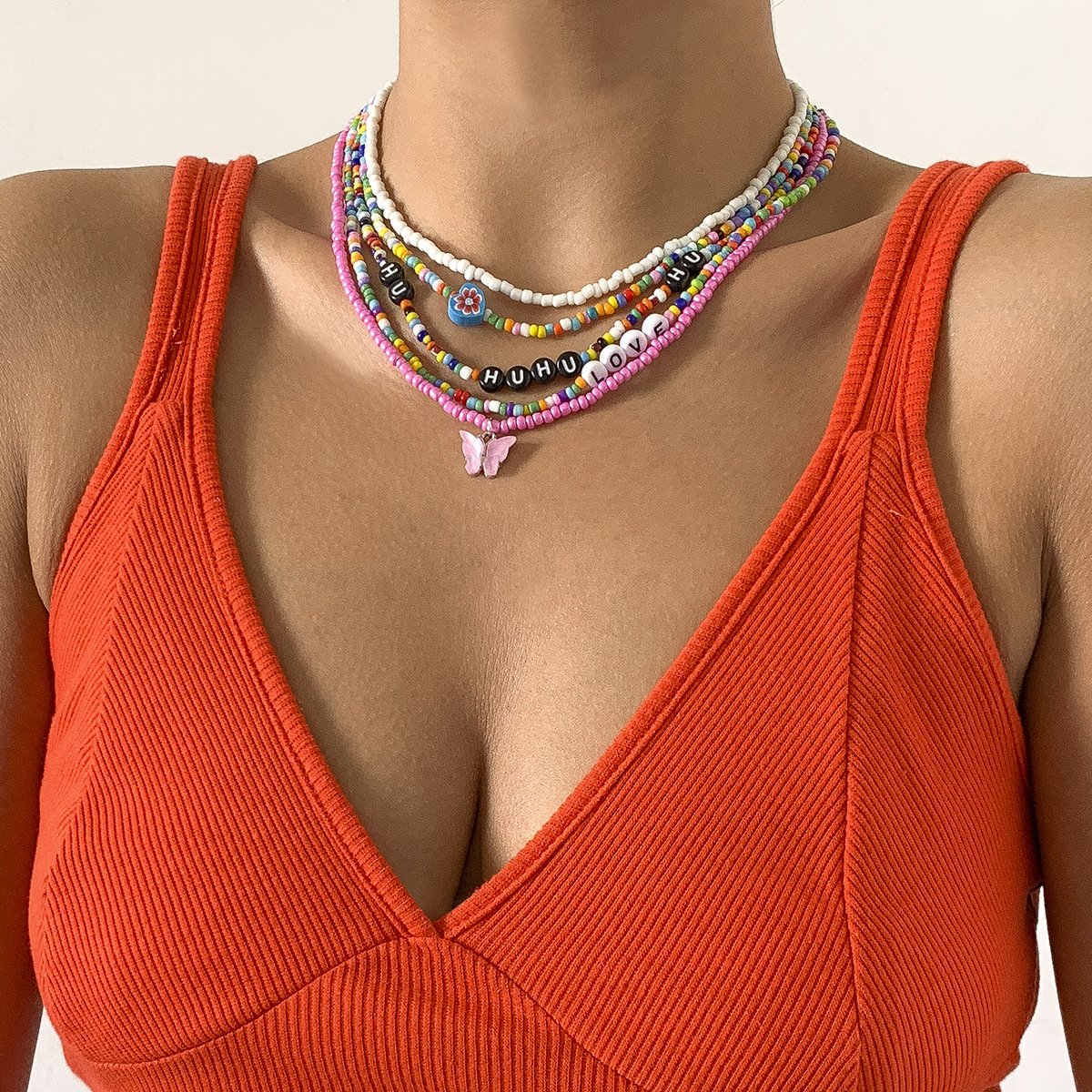Jewelry mix-and-match butterfly multi-layer tassel rice bead necklace female contrast color pastoral letter flower necklace