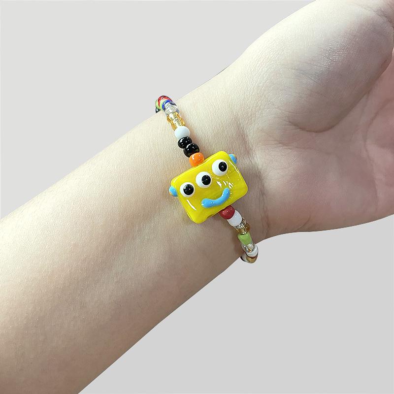 Cartoon little monster color beaded ceramic bracelet female niche design net red bracelet ins tide does not fade jewelry