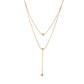 Double-layer stacked tassel necklace female small golden bean double-layer collarbone chain simple titanium steel transfer bead necklace