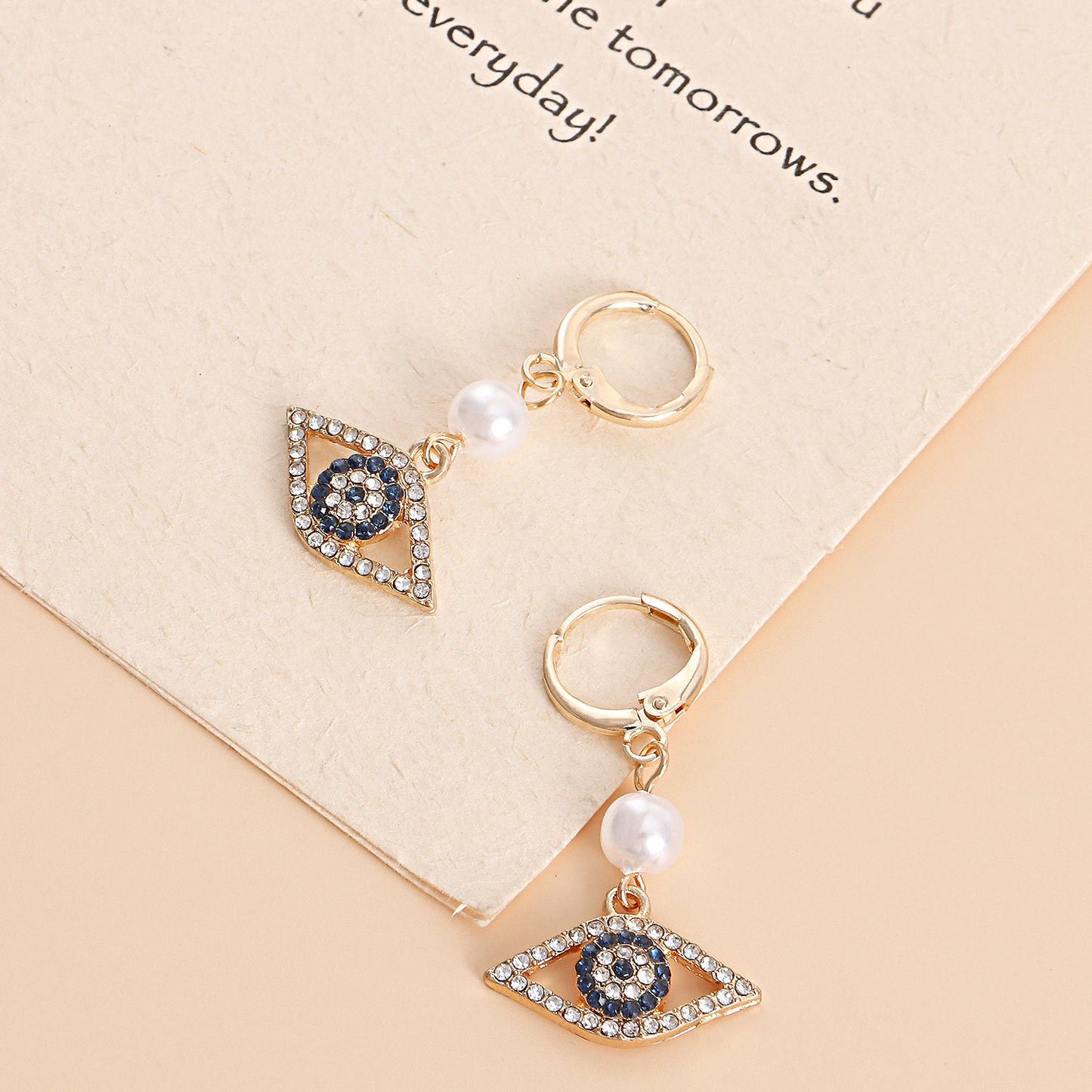 Jewelry micro-set diamond blue eyes pearl pendant earrings women's popular temperament earrings