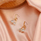 Ins copper inlaid zircon U-shaped geometric earrings French light luxury personality temperament hollow ball earrings earrings