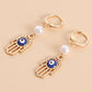 Fashion personality devil's eye palm pearl earrings women's hot style popular creative earrings