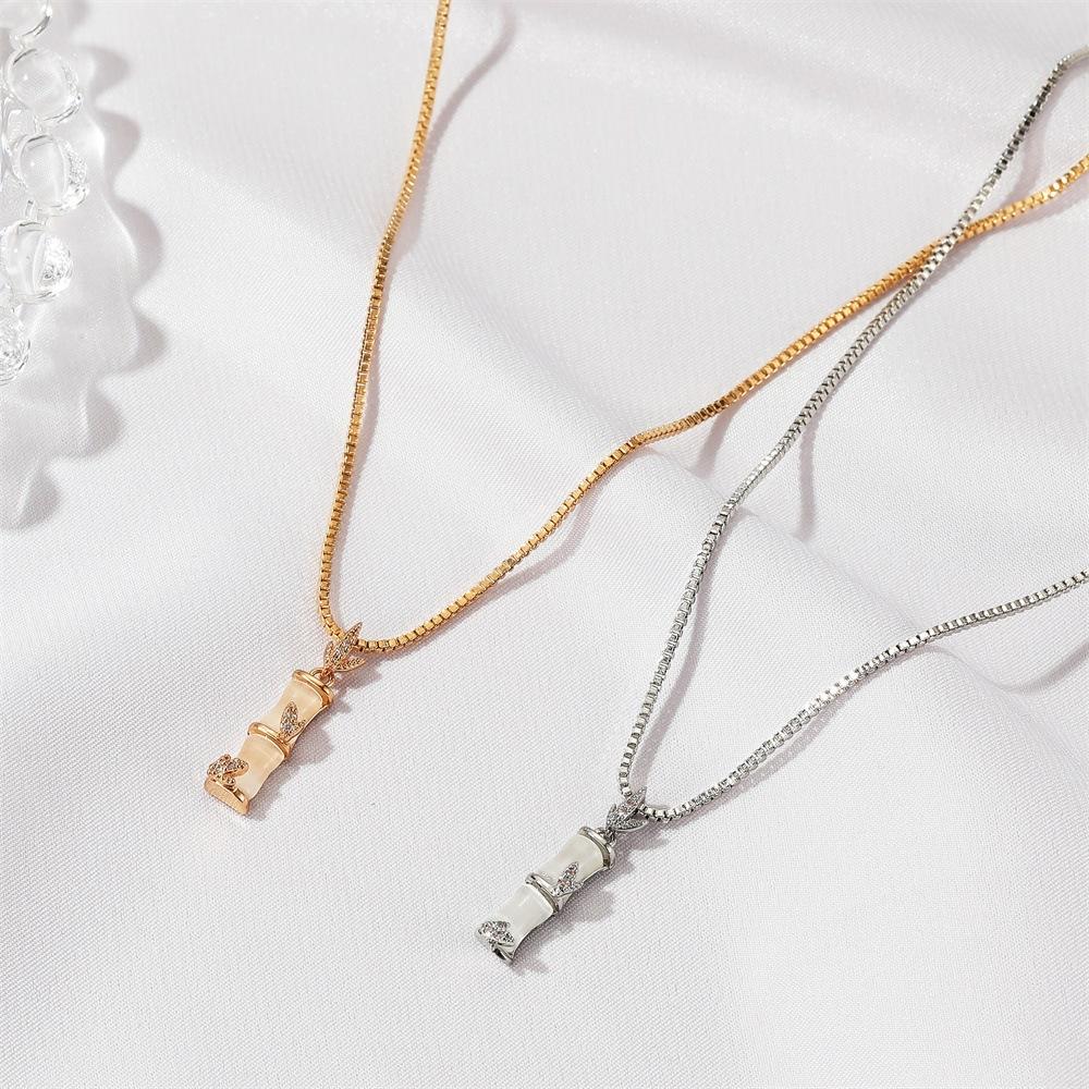 Temperament cat's eye carnation necklace female niche design exquisite bamboo pendant clavicle chain creative stall accessories