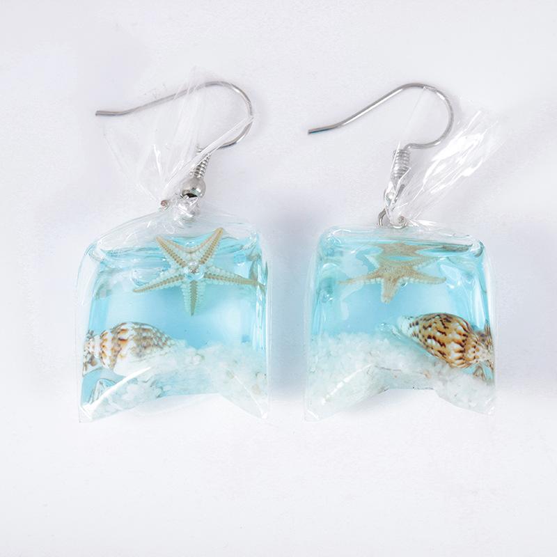 Creative transparent candy ocean conch earrings female personality resin dried flower plant earrings jewelry