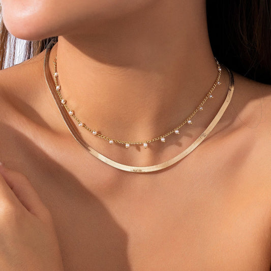 Jewelry cold snake bone chain necklace creative temperament imitation pearl tassel double layer necklace female
