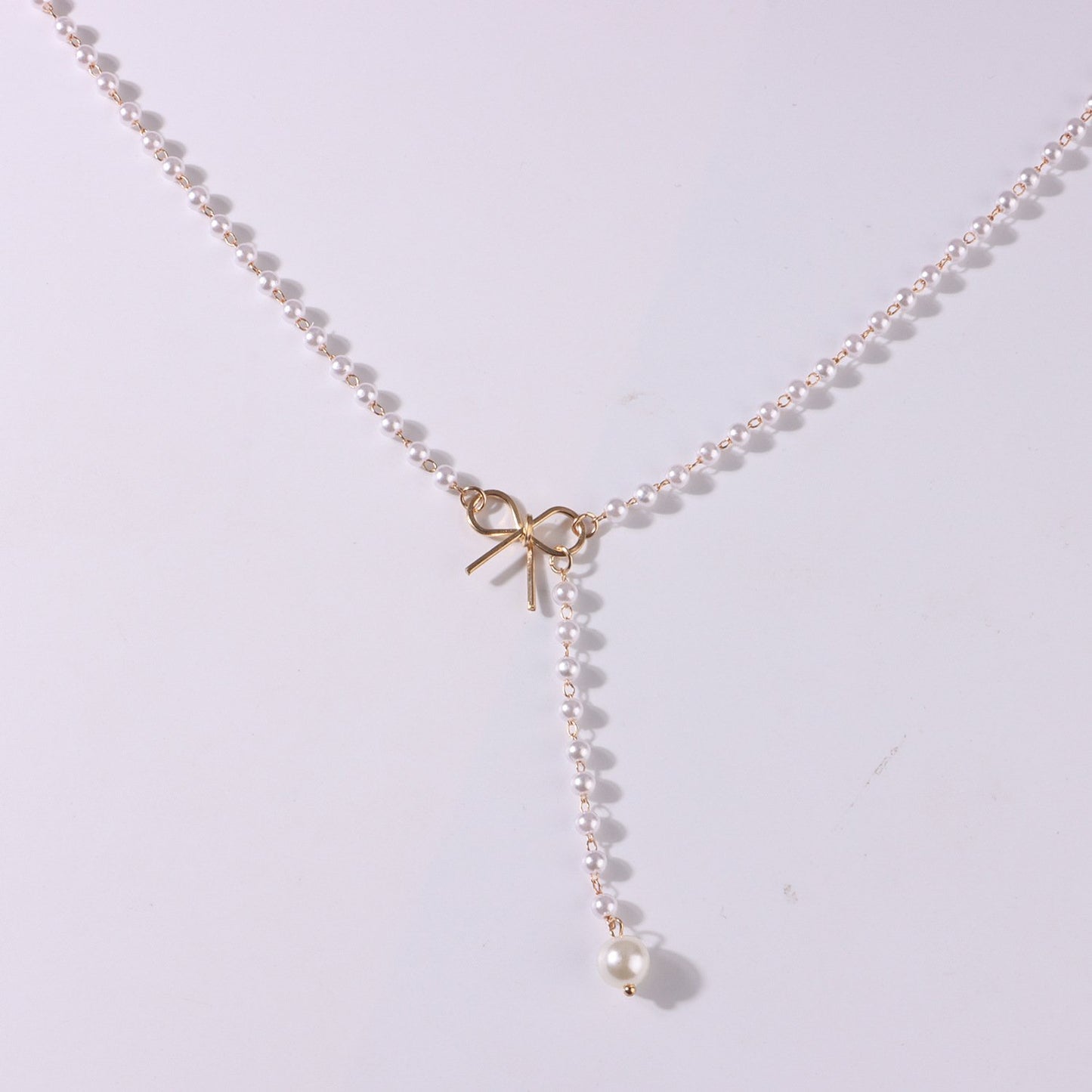 Jewelry Alloy Bow Knot Pearl Tassel Pendant Necklace Ladies Simple Temperament Popular Necklace