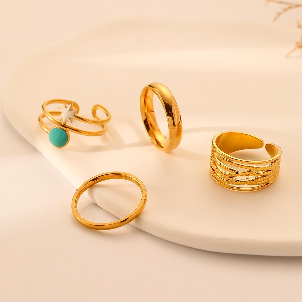 Light luxury niche trend fashion stainless steel opening star hollow four-piece suit ring female