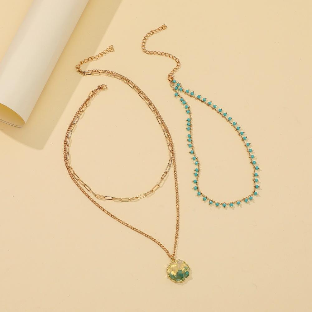 Fashion turquoise rice bead necklace personalized creative gravel pendant three-layer metal chain necklace tide