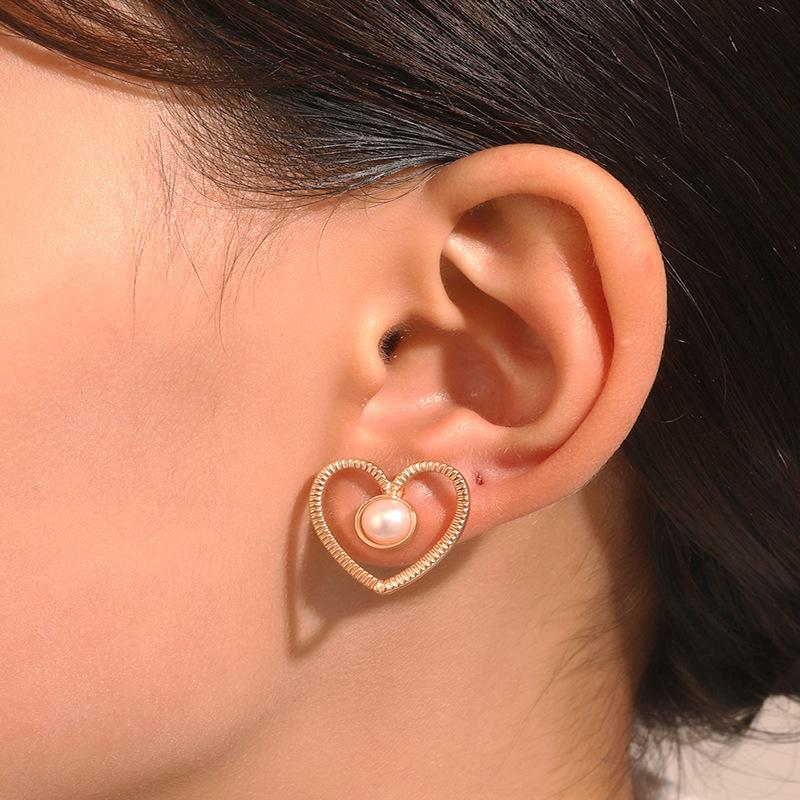 Ins inlaid pearl love earrings female fashion temperament niche design hollow love earrings simple earrings