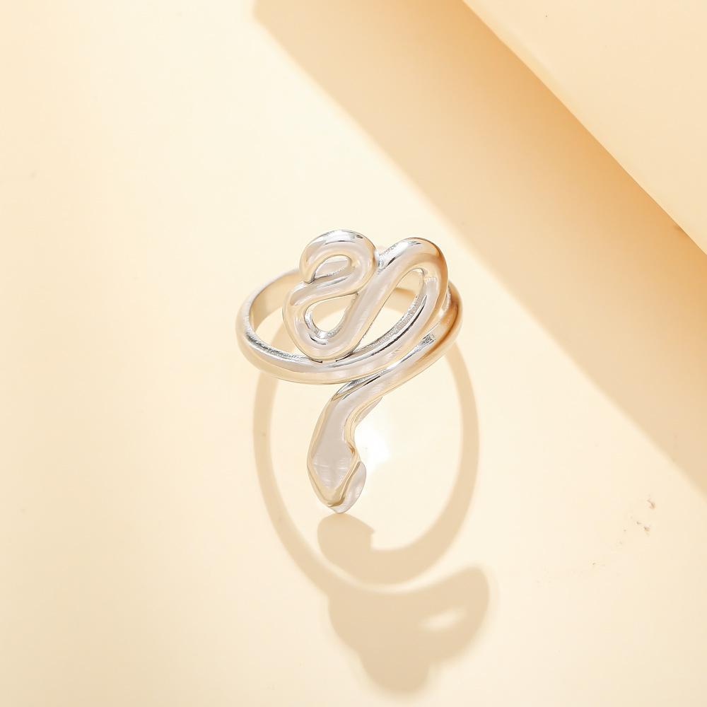 Trendy light luxury niche design green dripping oil snake-shaped stainless steel men's and women's rings