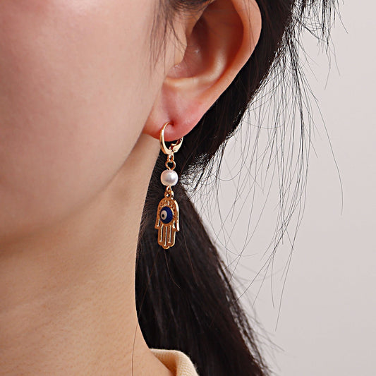 Fashion personality devil's eye palm pearl earrings women's hot style popular creative earrings