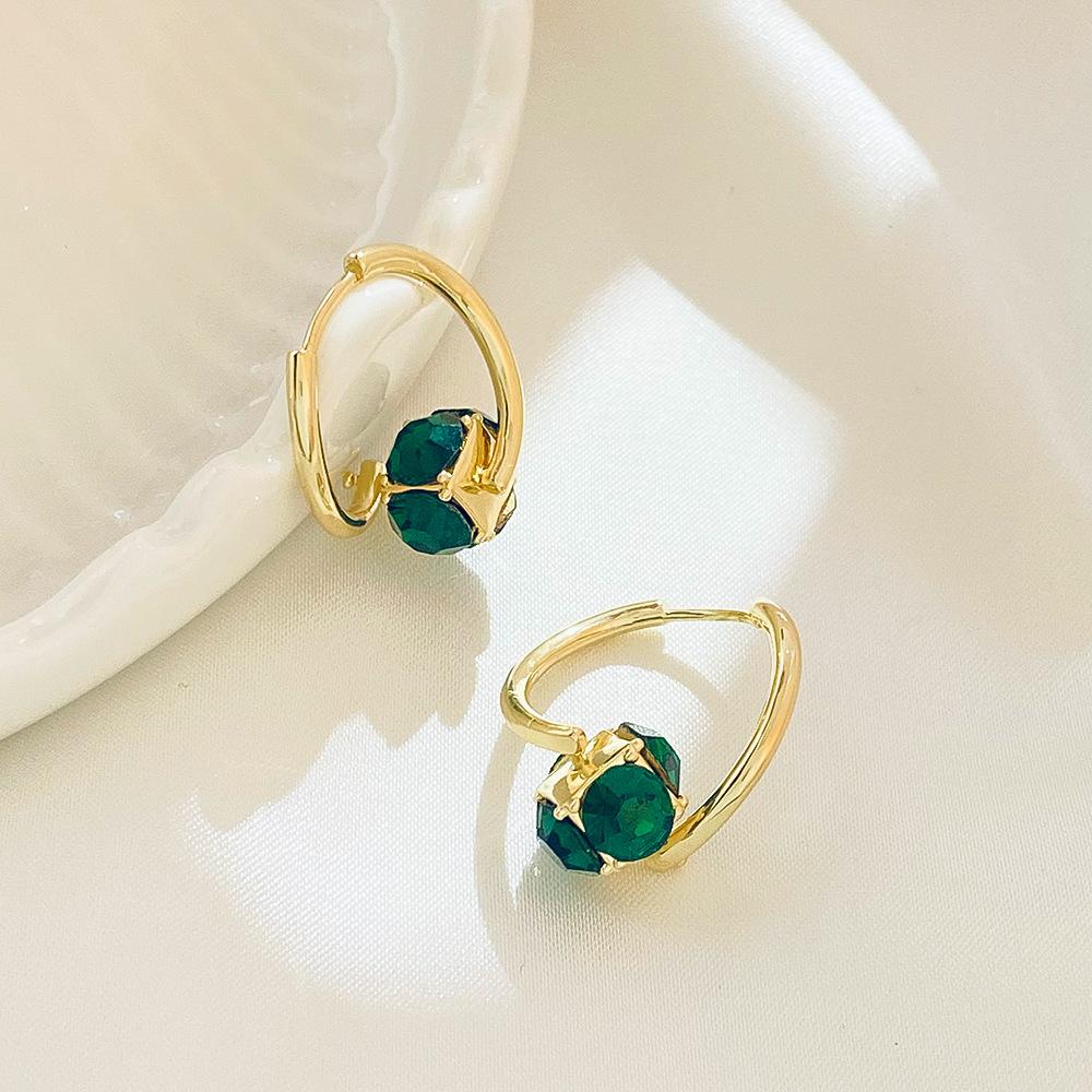 ins emerald zircon earrings French light luxury niche design rotating geometric ear buckle net red earrings trend